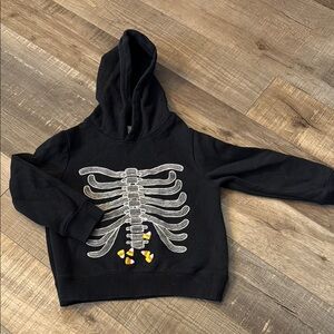 Black Skeleton Hoodie with Candy Corn Design
